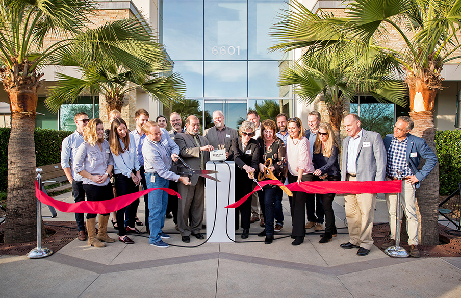 Group of people at a ribbon cutting event
